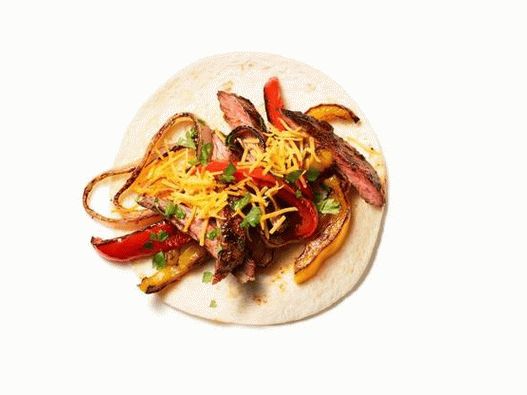 Foto di Fajitas con bistecca, cipolle e peperoni
