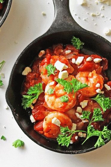 Foto Gamberetti al forno con pomodori e ouzo