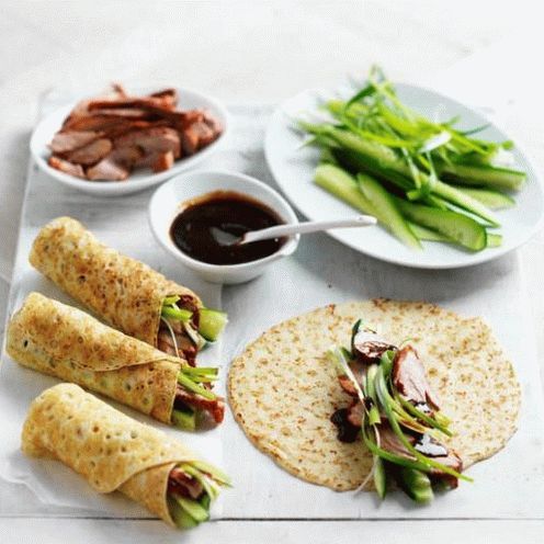 Foto Frittelle di mais con confit d'anatra e salsa barbecue