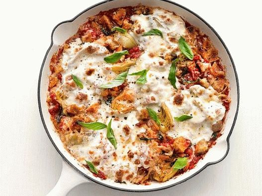 Foto di pollo parmigiano con carciofi in padella